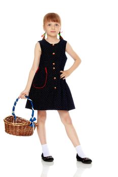 A little girl with a wicker basket made of willow twigs. The concept of family rest, harvesting, picking mushrooms and berries. Isolated over white background