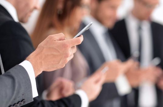 businessman using touch screen smart phone hands close up