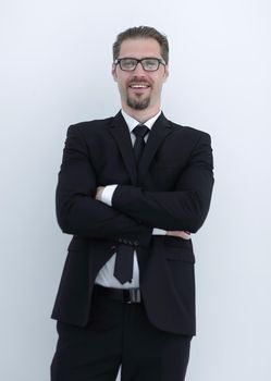 Stylish young man posing with crossed arms. Business concept