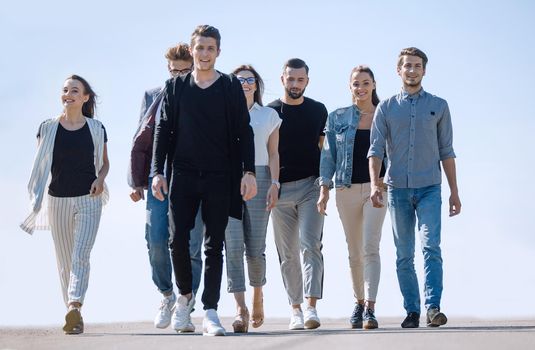 group of young people walking on the street.photo with copy space