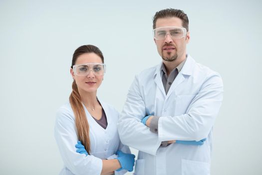 portrait of two scientists biologists on a light background