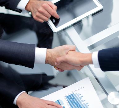 close up. investor and businessman shaking hands.