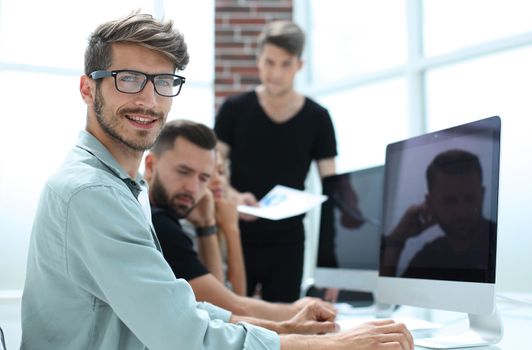 Creative people doing a brainstorming meeting in a modern studio