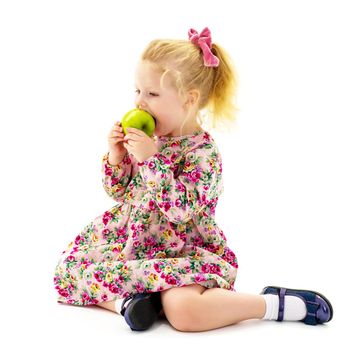 Little girl with an apple. Concept of healthy eating, harvesting. Isolated on white background.