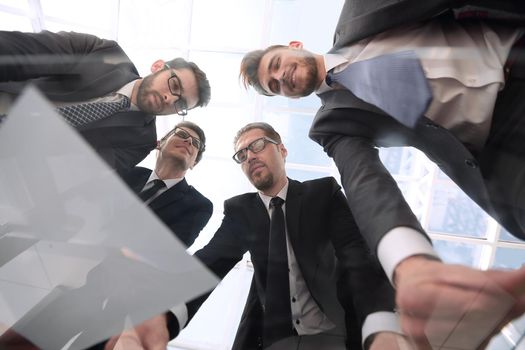 bottom view.business partners discussing the details of the contract .business concept