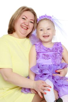 Mom and little daughter plus the size of the model, gently embrace. A woman and her daughter are smiling in a happy manner. Good for the concept of health, happiness, diet, obesity, weight loss.