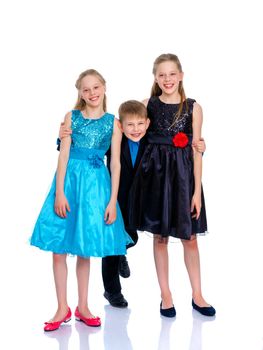 Group of happy little children posing in studio. The concept of a happy childhood, friendship.