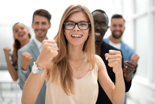 A group of business people from different ethnic backgrounds rejoices and celebrates their success in the financial and economic fields