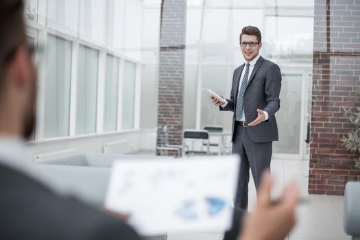 businessman discussing standing in the office. photo with copy space