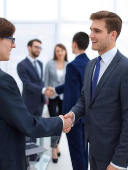 handshake of business partners after the briefing.