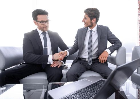 handshake of business partners at the meeting in the business center.business concept