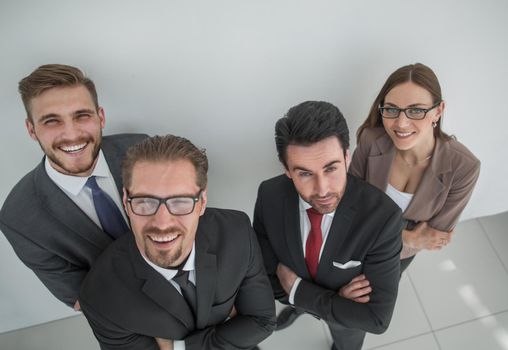 view from the top. group of smiling business people looking at camera.