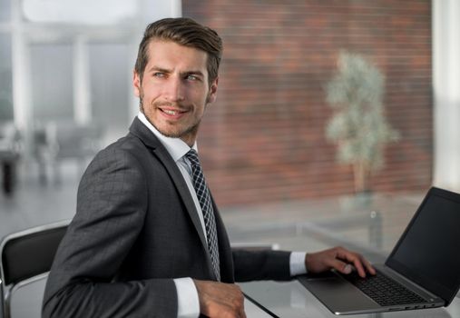 businessman sitting at the office table. photo with copy space