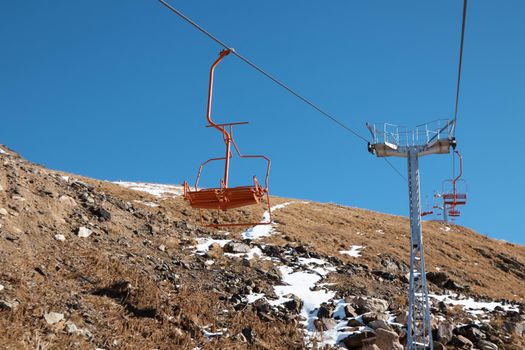 High quality photo about Dombay, alps, chairlift, ski lift, first snow in the mountains, sun and good weather, winter ski season