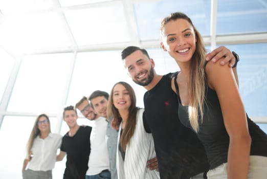 smiling business team standing in the new office.the concept of teamwork