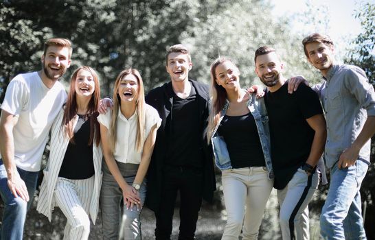 group of friends standing in the city Park. the concept of team