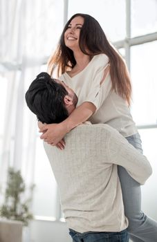 Happy loving couple kissing feeling excited about moving into new home.photo with copy space
