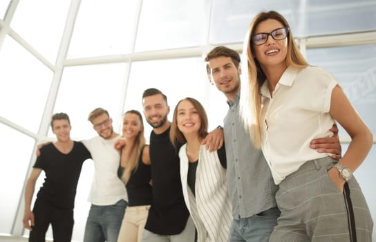 group of young people standing in the new office.the concept of teamwork