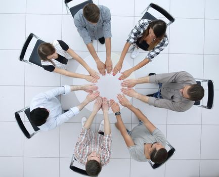 top view.successful business team sitting at the round table.the concept of teamwork