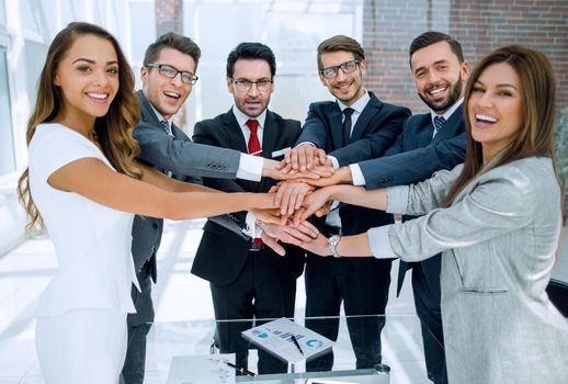 happy business team standing in office. the concept of teamwork