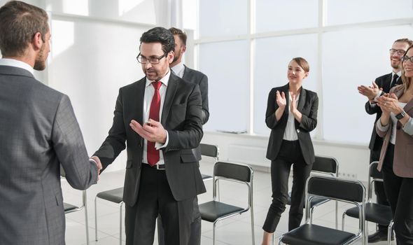 business meeting in the modern conference hall, congratulations, success, meeting