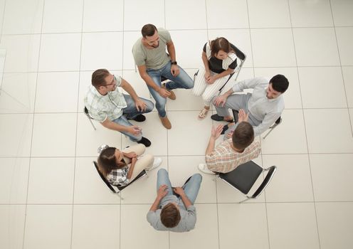 top view.business team discussing current issues.the concept of teamwork