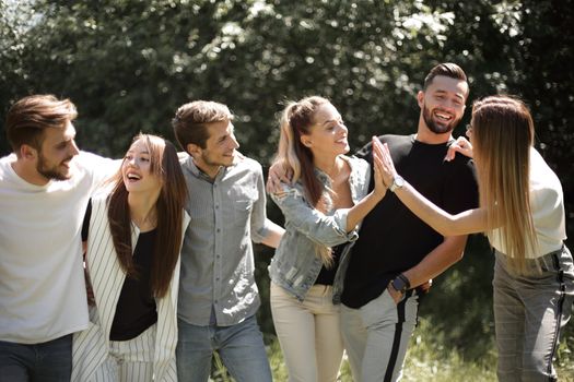 friends on a walk, give each other a high five.photo with copy space