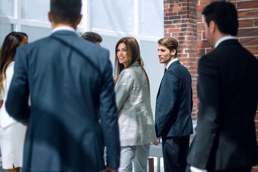 group of business people talking, standing in the lobby of the business center.photo with copy space