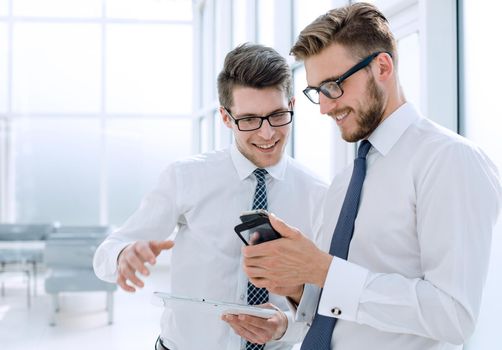 close up.young employees use gadgets in their office.people and technology