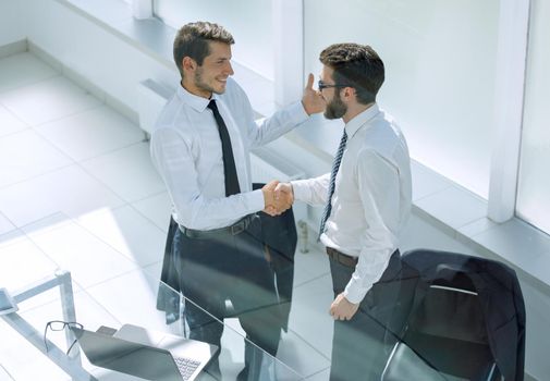 close up.handshake business people in the office.business concept