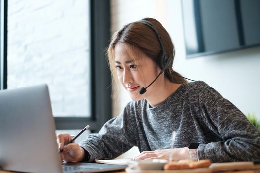 Customer service representative with a headset and work at home. business support team concept