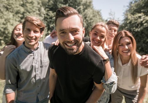 leader and the business team have fun in their free time. team building outdoors