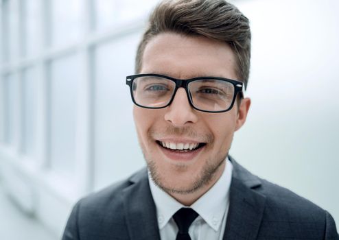 close up.portrait of a young businessman on a light background