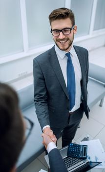 close up.business people greet each other with a handshake.business concept