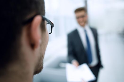 .business man looking carefully at the Bank office.business background