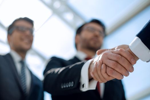 close up.handshake business people.business background