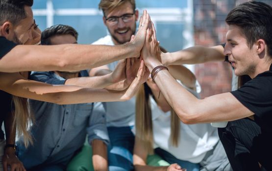 creative business team showing their unity . the concept of teamwork