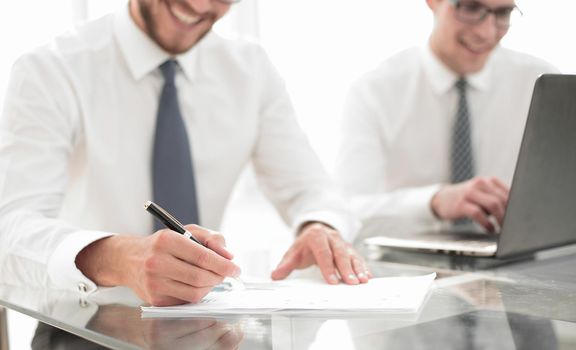 close up.businessman checking financial report.business concept