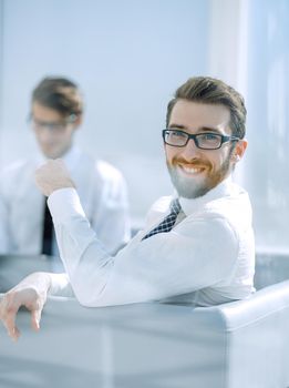 business background.employees sitting in the office lobby .photo with copy space