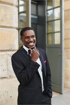 Afro american man wearing suit and standing outside. Concept of black businessman.