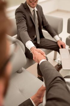 close up.handshake business people in the office lobby.business concept