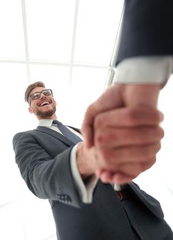 close up.business handshake.isolated on light background