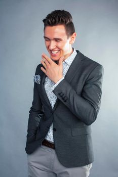 young pretty businessman posing emotional gesturing on white background, lifestyle people concept close up