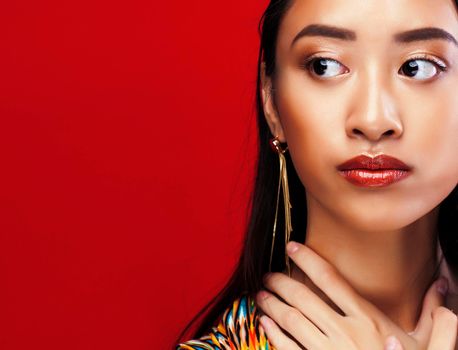 beauty young asian girl with fashion make up on red background , beauty stylish look close up