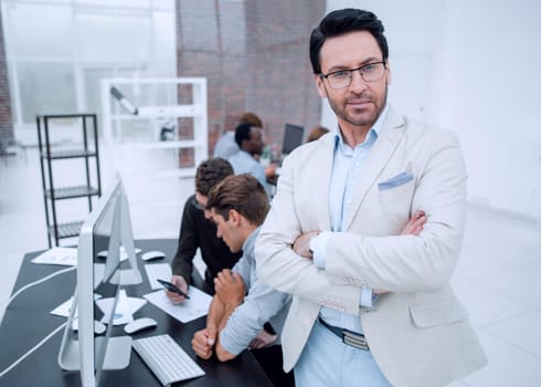 confident businessman in the background of the office.business concept