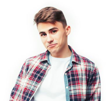 young handsome teenage hipster guy posing emotional, happy smiling against white background isolated, lifestyle people concept close up