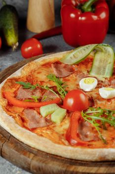 Children's pizza in the shape of a cat's face on a white plate, on a white background, top view. Children's menu.