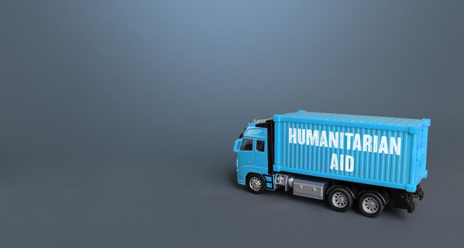 A truck with humanitarian aid. Collection and delivery of humanitarian cargo and supplies to the affected regions. Help and support for victims of wars and natural disasters. Charity foundations