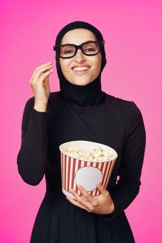 pretty woman attractive look popcorn glasses movie watching purple background. High quality photo
