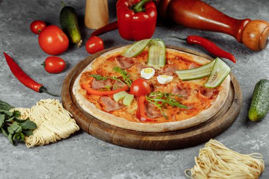 Children's pizza in the shape of a cat's face on a white plate, on a white background, top view. Children's menu.